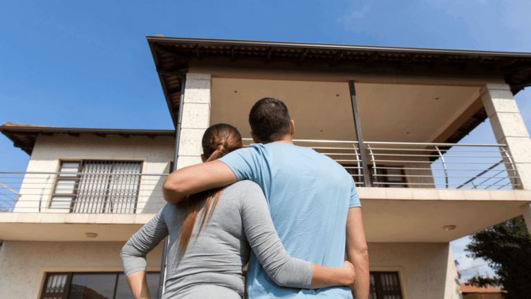 A happy couple looking at a newly built home