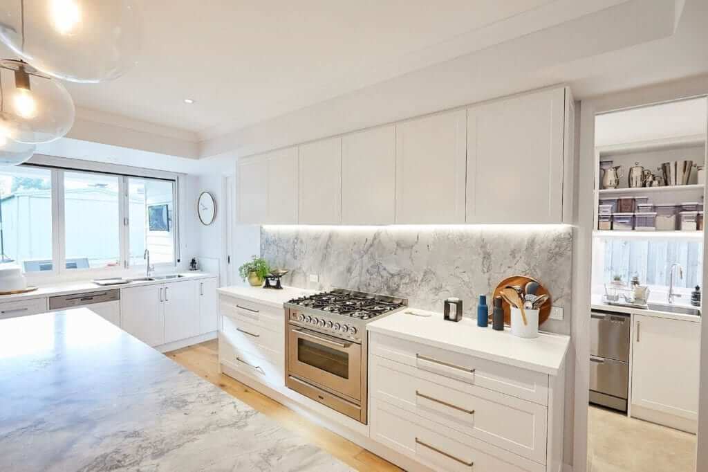 A photo of a completed white kitchen