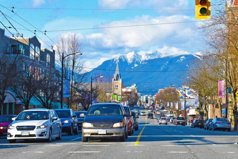 A photo of Vancouver, Canada with snow-covered mountains in the background