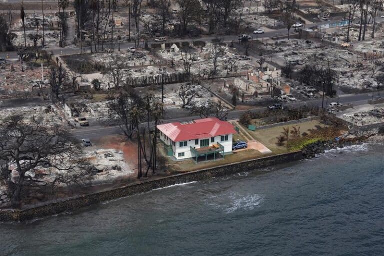 A coastal home in Maui sits alone amid a neighborhood devasted by wildfire