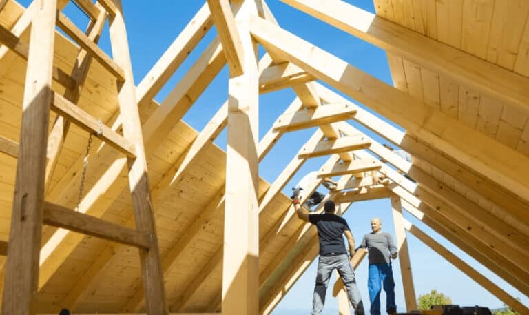 Builders frame a custom home under construction