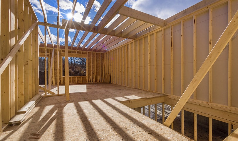 Timber framing of a new build in the sun