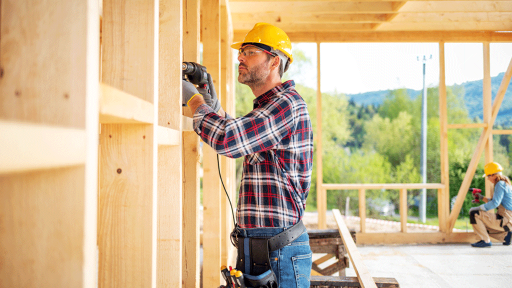 A home builder frames an interior wall