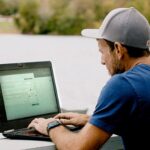 Home builder Ron Marcella checks on a project using Buildxact on his laptop.