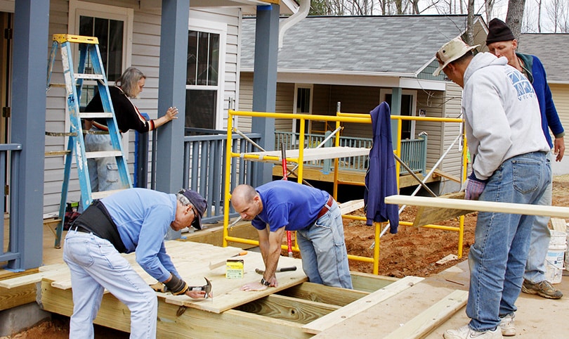 A group of builders working on a job site together