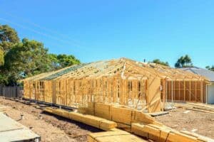 a house under construction showing its wooden frame