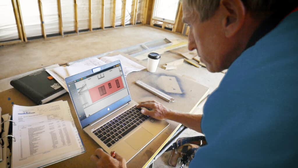 A customer studies a digital takeoff from Buildxact