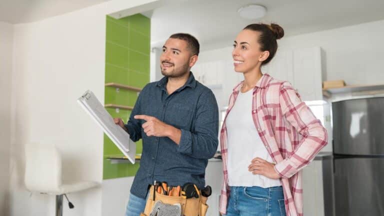 A builder and a homeowner communicating in a home.